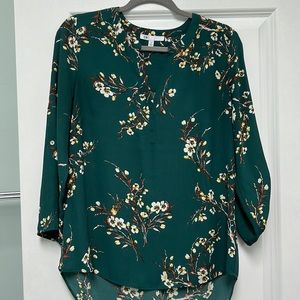 Beautiful dark green medium top great for work and casual attire